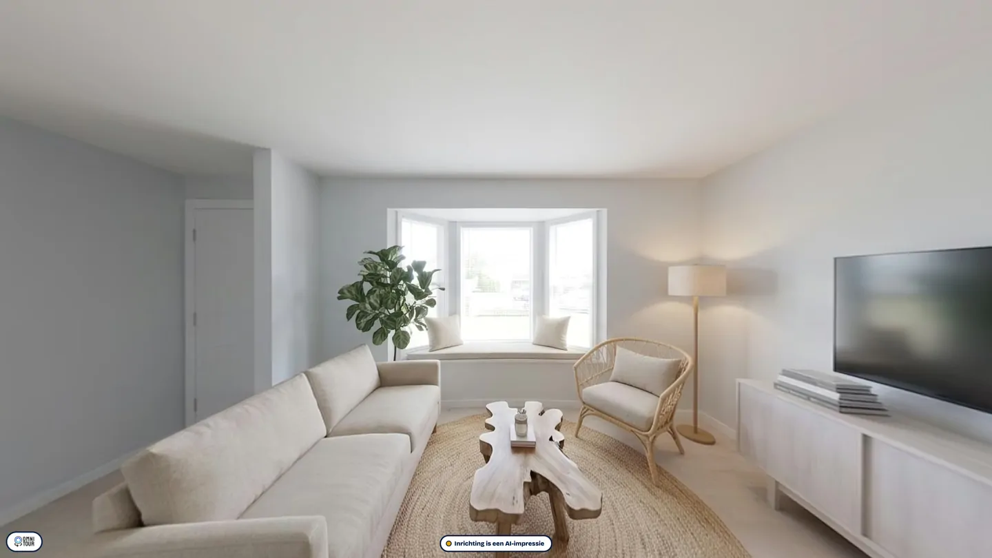 The same living room furnished as a holiday home.